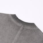 Camiseta sin mangas con borde sin rematar y costura trasera de 7.5 oz