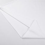 Camiseta de algodón de color liso y corte relajado de 6,6 oz