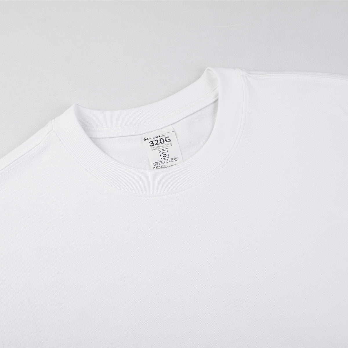 Camiseta de algodón de color liso y corte relajado de 6,6 oz