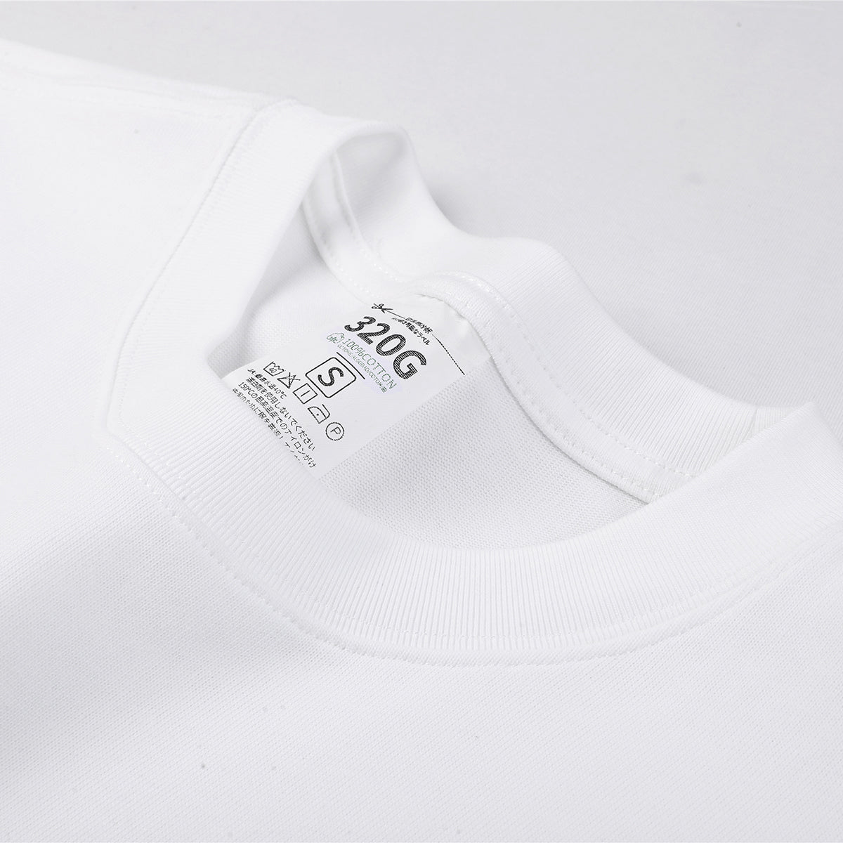 Camiseta de algodón de color liso y corte relajado de 6,6 oz