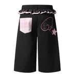 Bermudas de mezclilla desgastada con estampado de salpicaduras