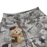 Bermudas de mezclilla desgastada con estampado de salpicaduras