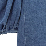 Vestido midi vaquero sin mangas con botones y aberturas en la parte delantera