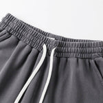 Pantalones cortos deportivos con bordes sin rematar y lavados a la piedra