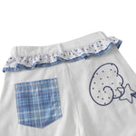 Bermudas de mezclilla desgastada con estampado de salpicaduras