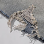 Bermudas vaqueras rasgadas con parches de camuflaje