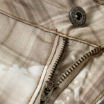 Bermudas vaqueras rasgadas con parches de camuflaje