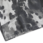 Bermudas de mezclilla desgastada con estampado de salpicaduras