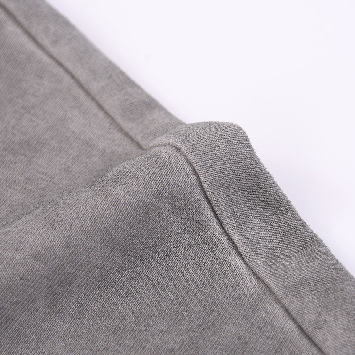 Camiseta sin mangas con borde sin rematar y costura trasera de 7.5 oz