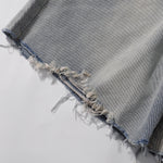 Bermudas vaqueras rasgadas con parches de camuflaje