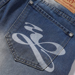 Bermudas vaqueras rasgadas con parches de camuflaje